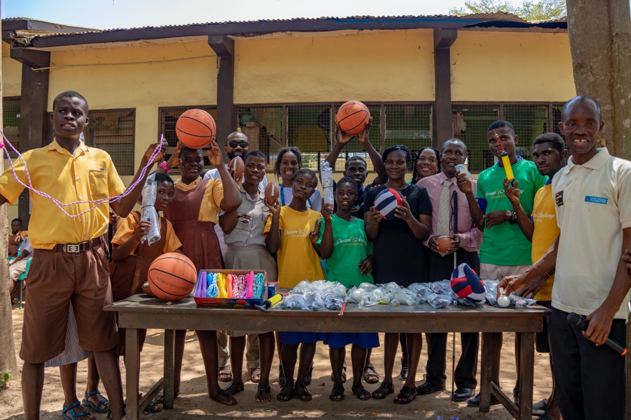 Ghanaian students play with basketballs and lanyards