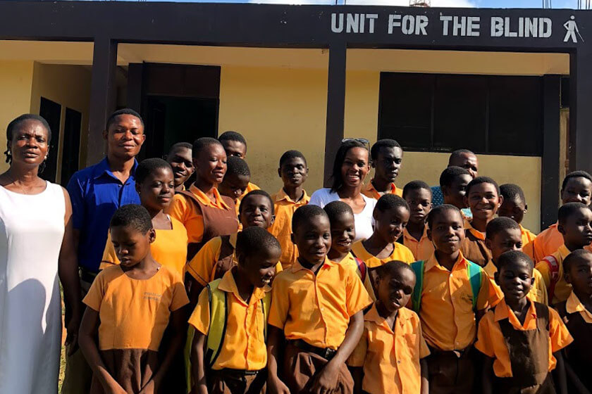 Sierra Dockery with students and staff in Ghana